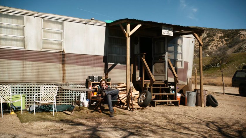 JT James outside his mobile home in Badlands.