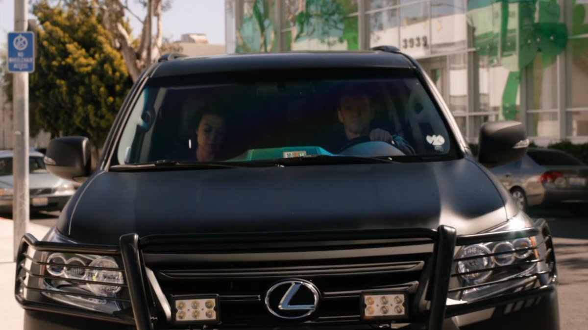 May and Coulson in SHIELD SUV outside Illinois parking structure.