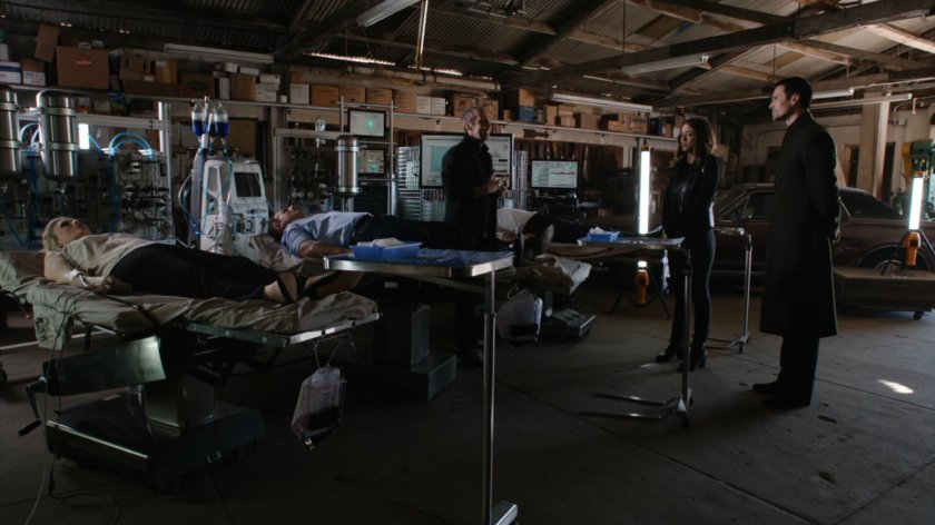 Daisy and Hive looking at Radcliff's experiment in Union City Garage.