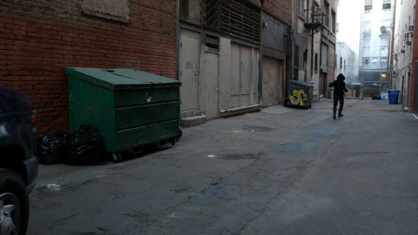 James runs into alley followed by Watchdog van.