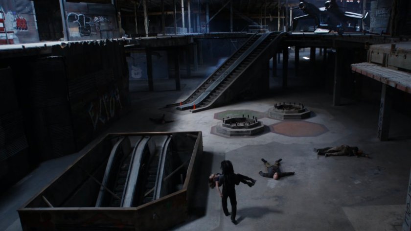 Lash carrying Daisy through abandoned shopping mall.