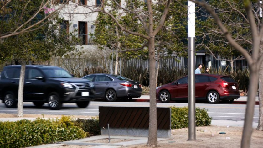 SHIELD SUV racing along city street.