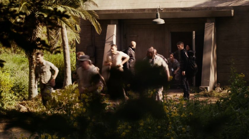 Soldiers escape from bunker on Pacific island.