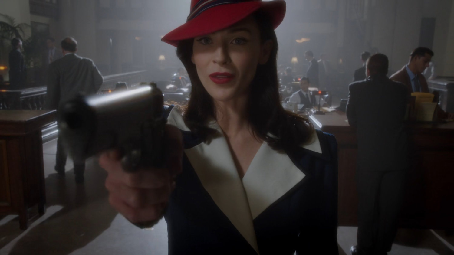 Dottie holding a gun inside Bowery Savings Bank.