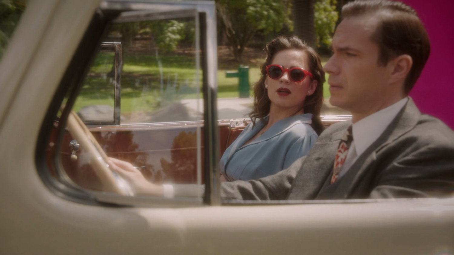 Jarvis drives Peggy along a Los Angeles road.