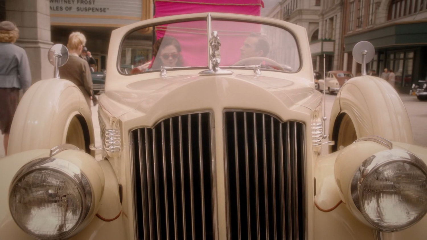 Peggy and Jarvis in car in front of the Auerbach Theatrical Agency