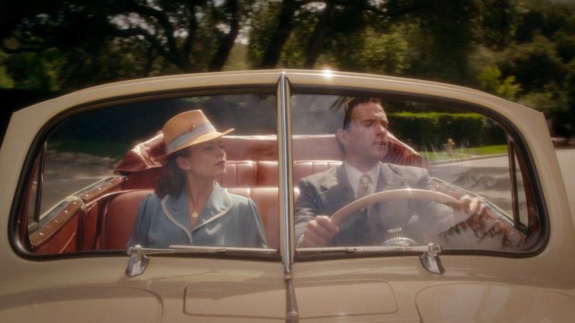 Peggy and Jarvis in car outside Stark's mansion.