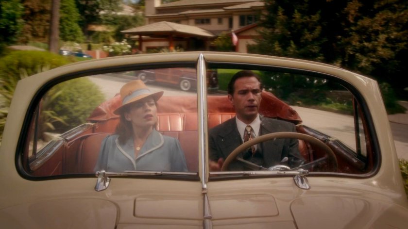 Peggy and Jarvis in car outside Stark's mansion.