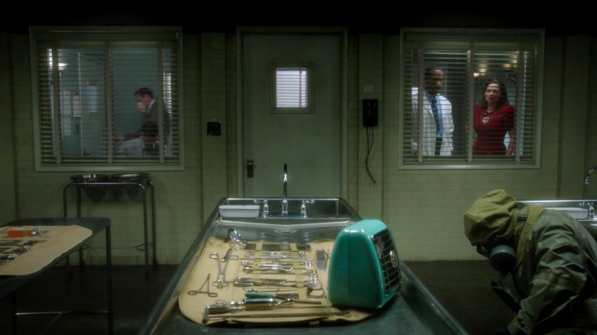 Jason and Peggy looking into the coroners operating theater.