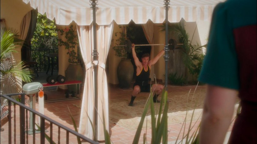 Jarvis weightlifting on the patio of Stark Mansion.