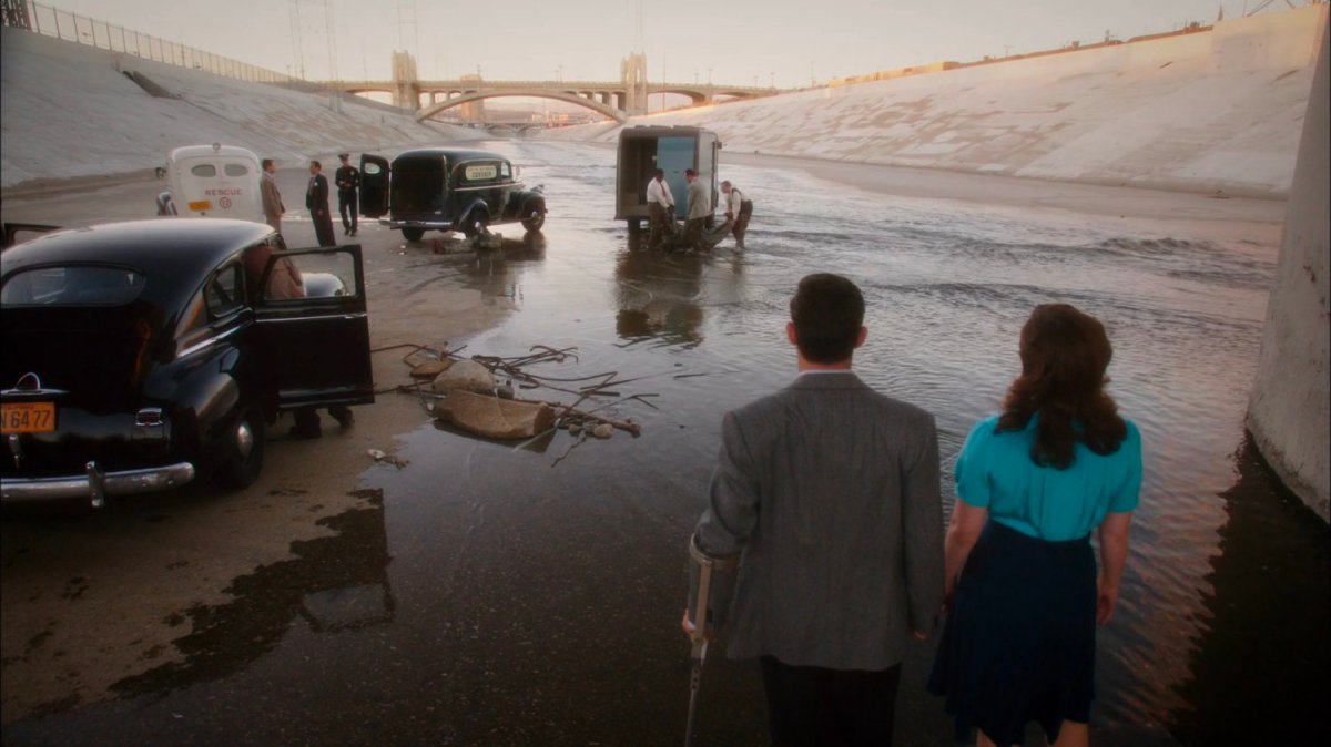 Peggy and Sousa looking at emergency vehicles in Los Angeles River.
