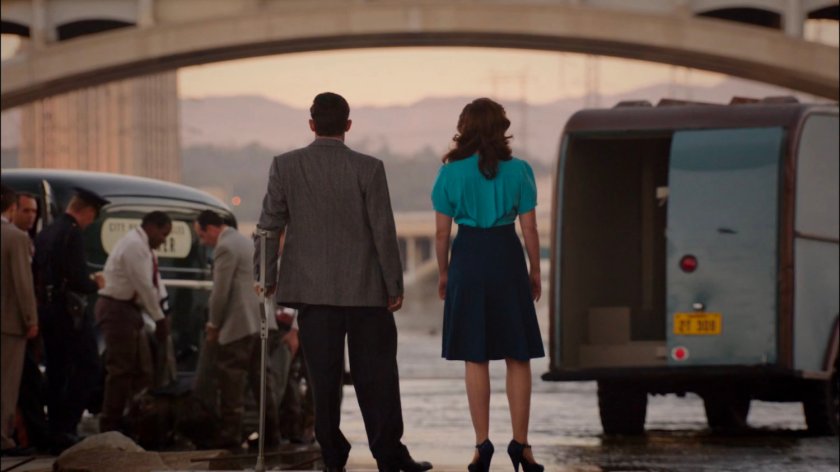 Peggy and Sousa looking at emergency vehicles in Los Angeles River.