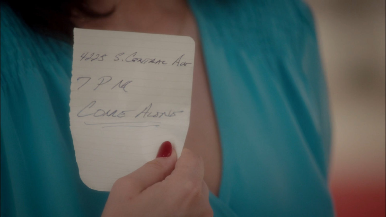 Peggy holds a note with the address for the Dunbar Hotel.