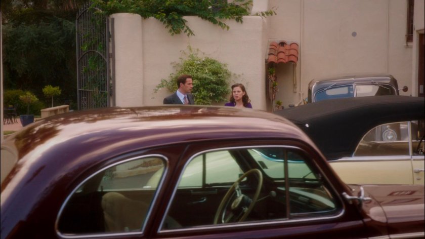 Jarvis and Peggy outside Stark Mansion in driveway.