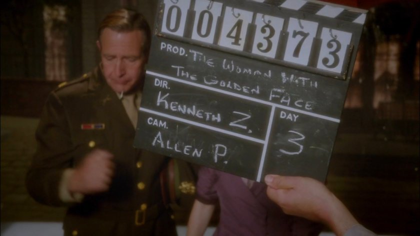 Film slate being held in front of camera for "The Woman with the Golden Face."