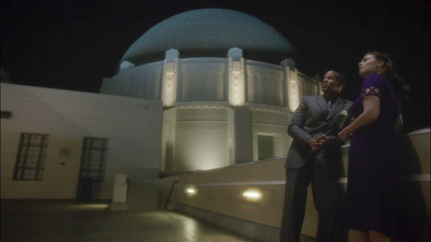 Jason and Peggy outside Griffith Observatory at night.