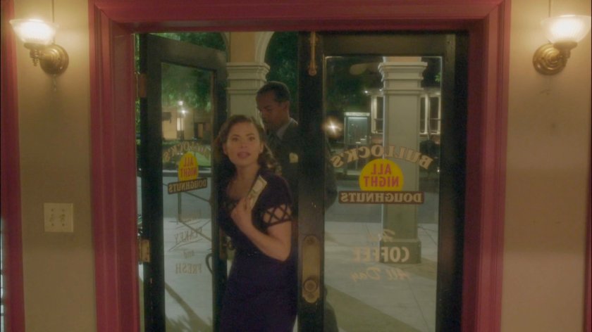 Peggy and Jason enter Bullock's All Night Doughnuts.