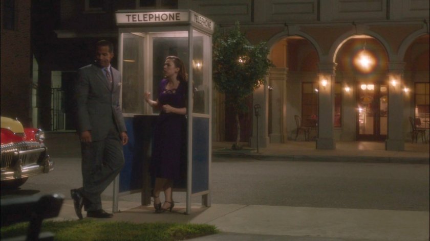 Peggy and Jason at phone booth outside Bullock's All Night Doughnuts.