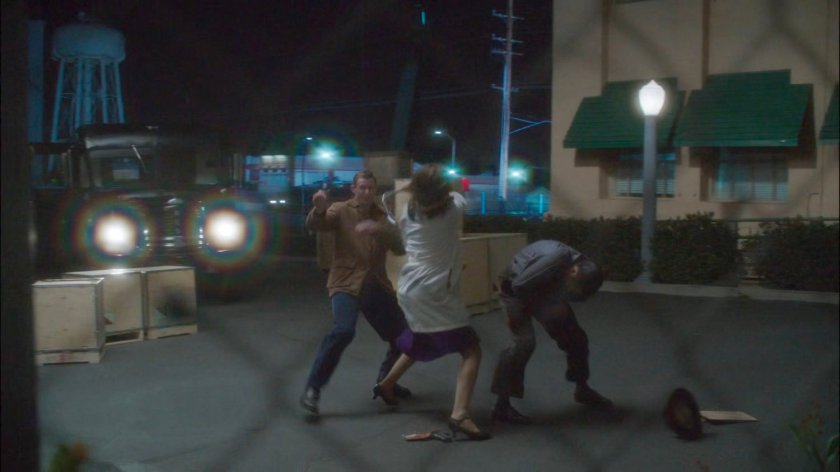 Peggy fighting thugs on loading dock outside Isodyne Energy.