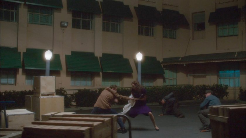 Peggy fighting thugs on loading dock outside Isodyne Energy.