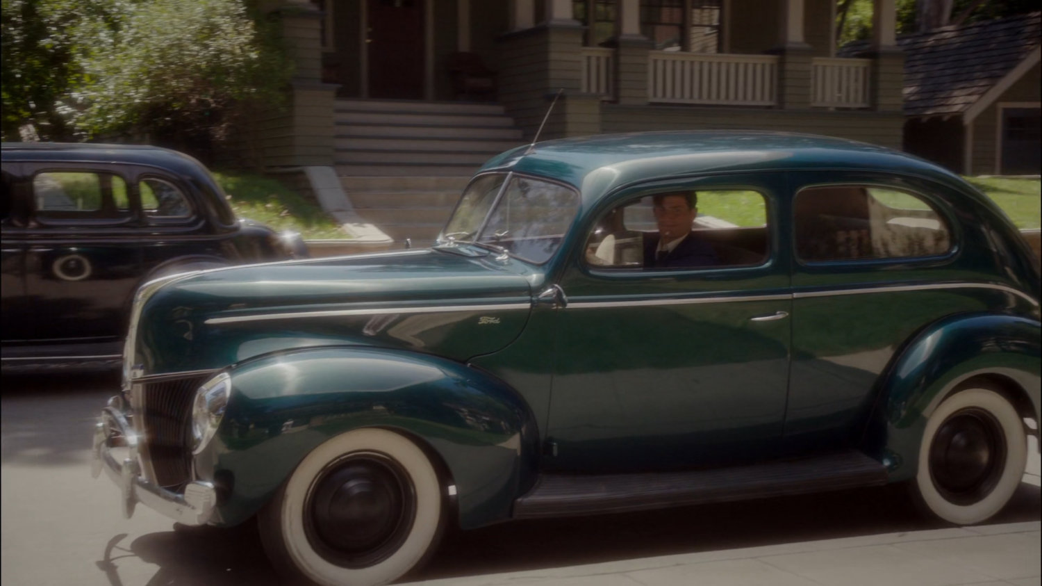 Sousa parking car on the street outside his house.