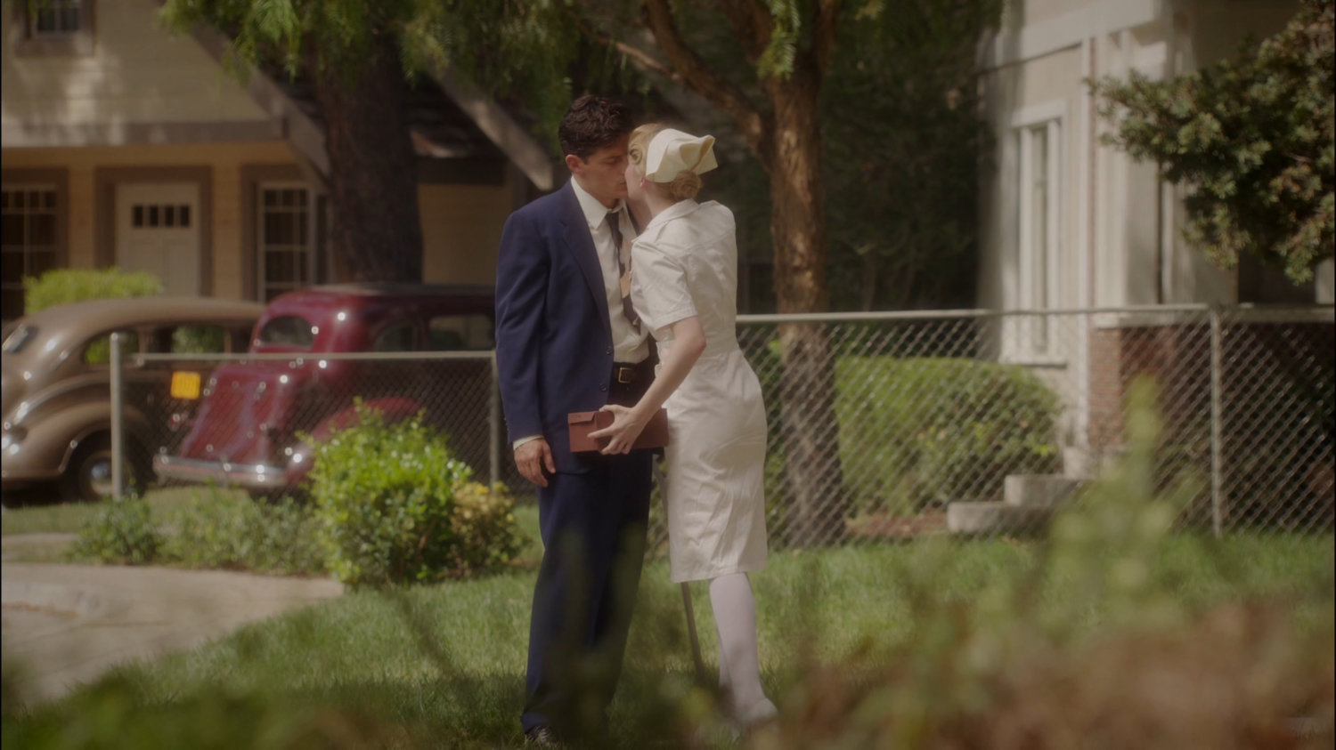Sousa and Violet kiss outside his house.