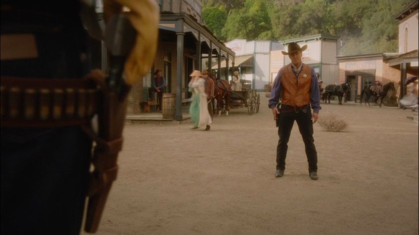 Kid Colt, and a sheriff on a western set at Stark Pictures.