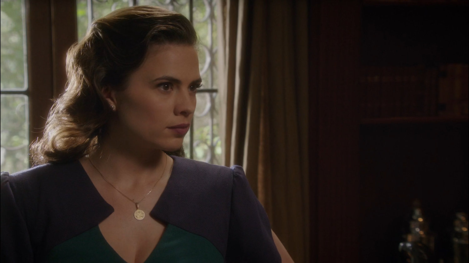Peggy in Howard Stark's office at Stark Pictures.