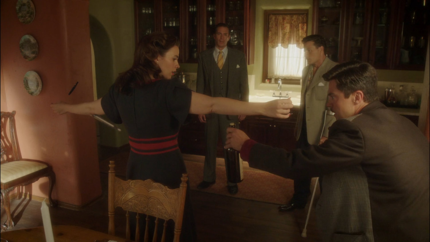 Peggy, Jarvis, Howard, and Sousa in Stark's dining room/kitchen.