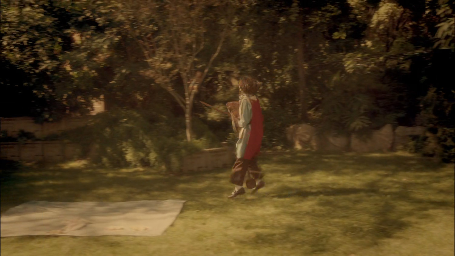 Young Peggy playing in her backyard.