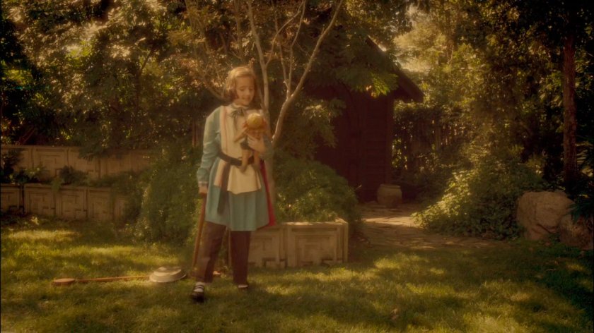 Young Peggy playing in her backyard.