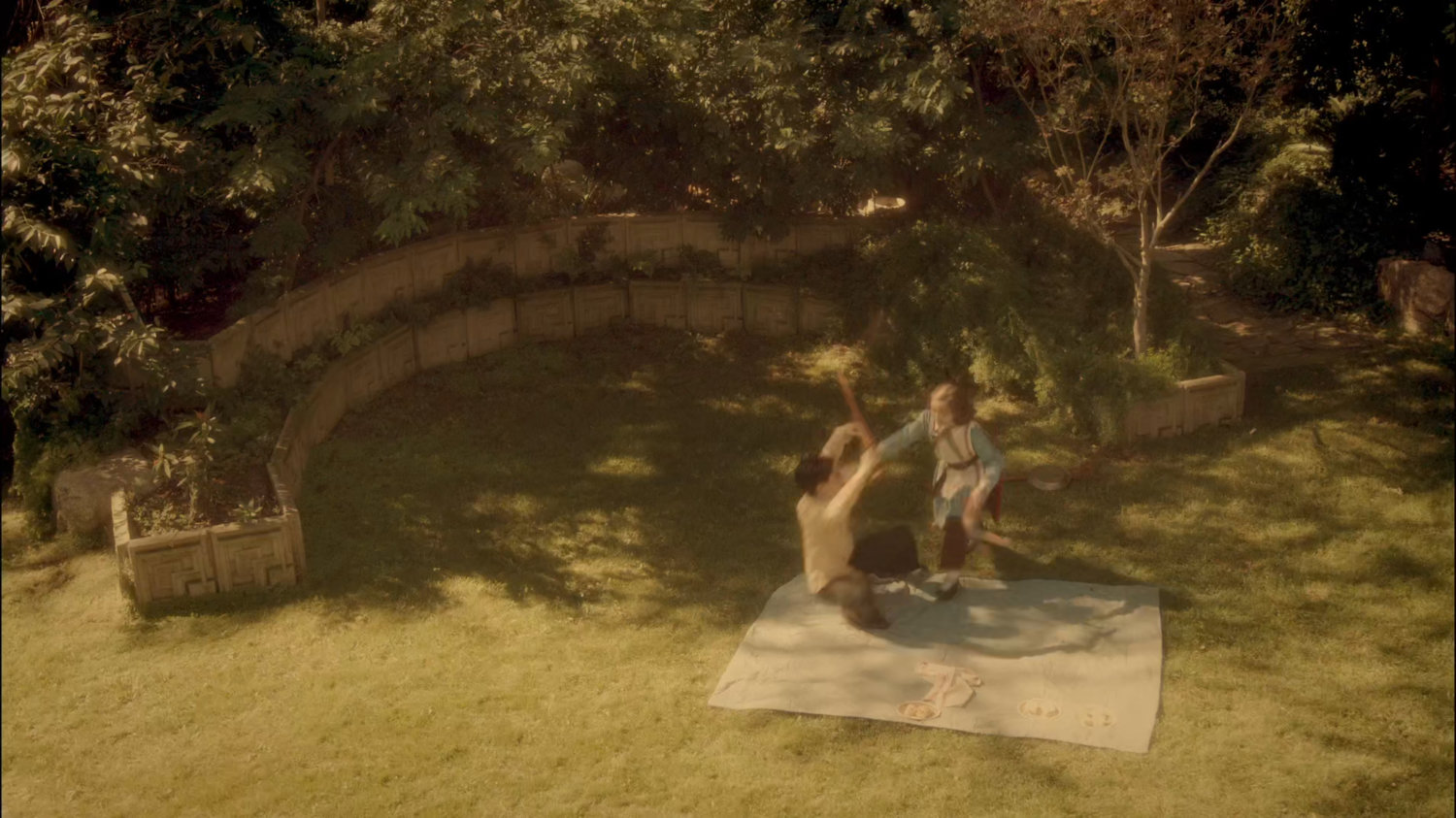 Young Peggy playing with her brother Michael in their backyard.