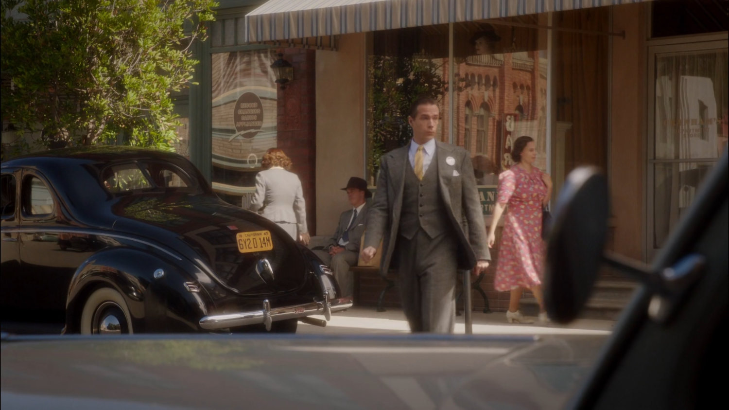 Jarvis crossing the street outside of Chadwick Campaign Headquarters.