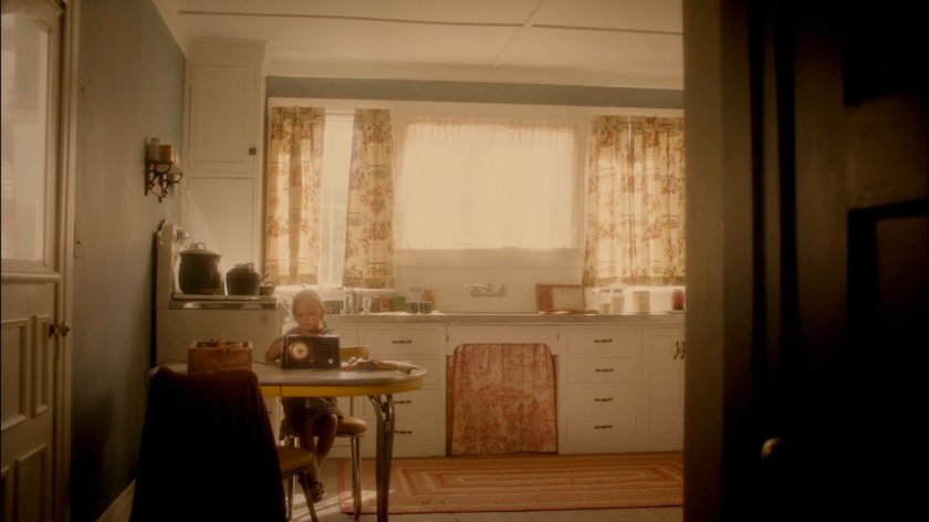Young Agnes Cully in her kitchen working on a radio.