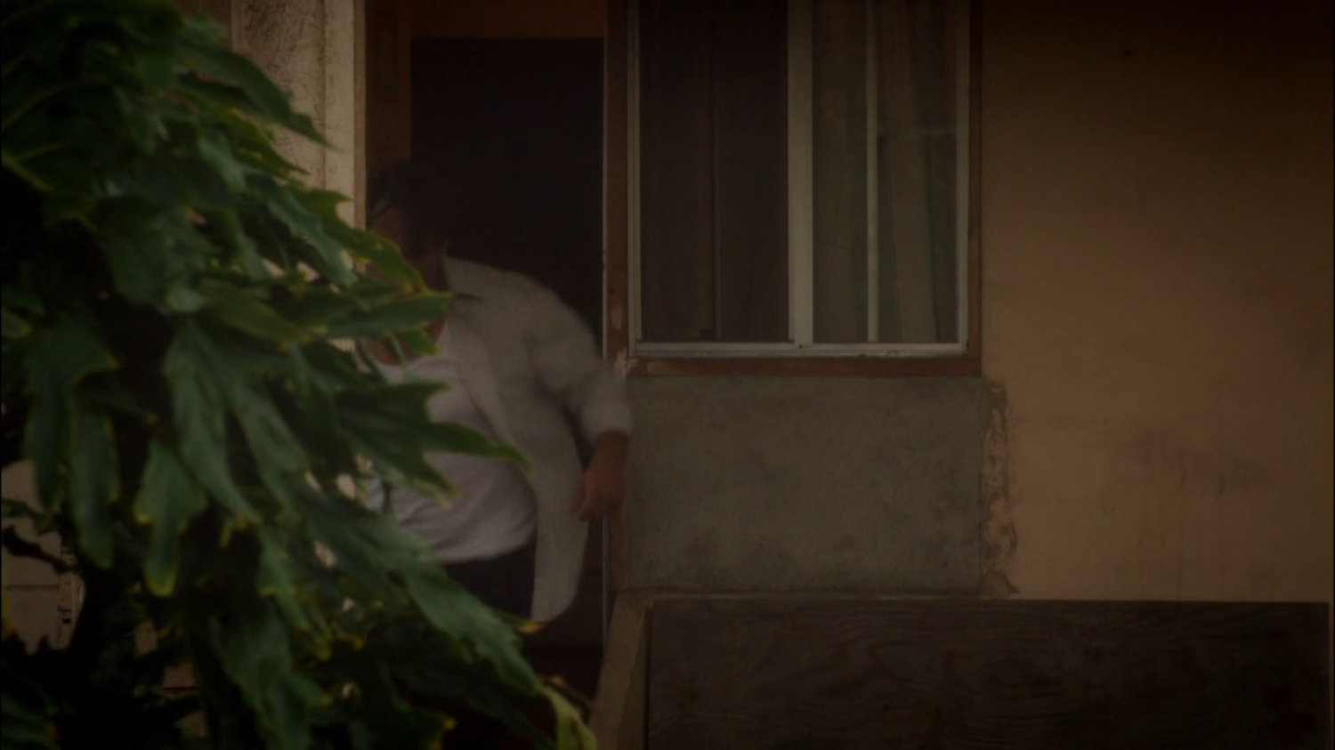 Rufus Hunt flees from his back door.