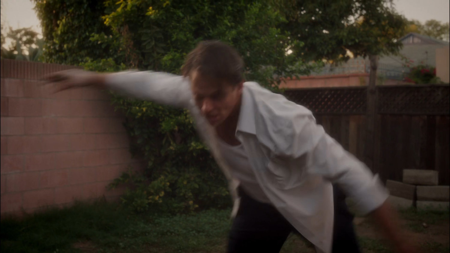 Rufus Hunt lunges in his backyard.