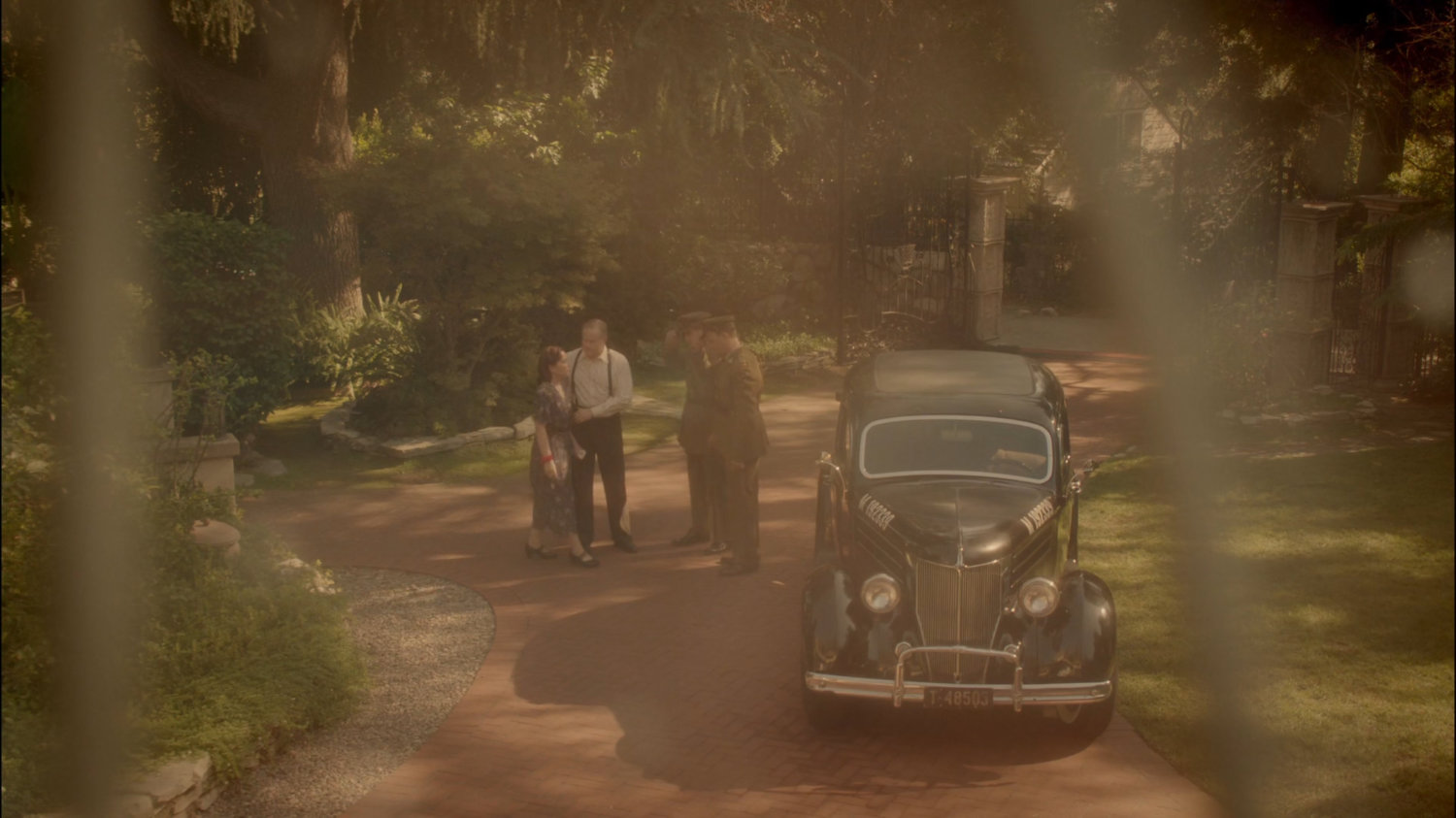 Two men from the army meeting with Mr & Mrs Carter in front driveway.