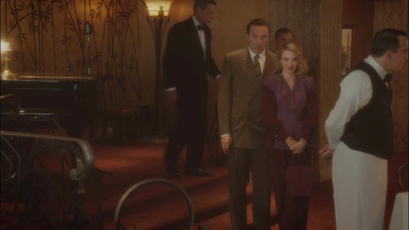 Calvin and Whitney entering a restaurant.