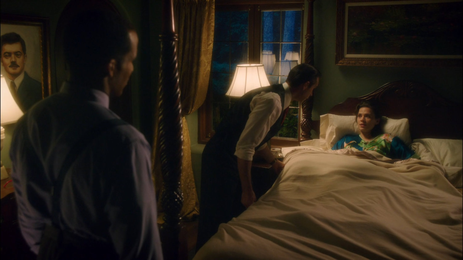 Jarvis tucking Peggy into bed in a Stark Mansion bedroom.