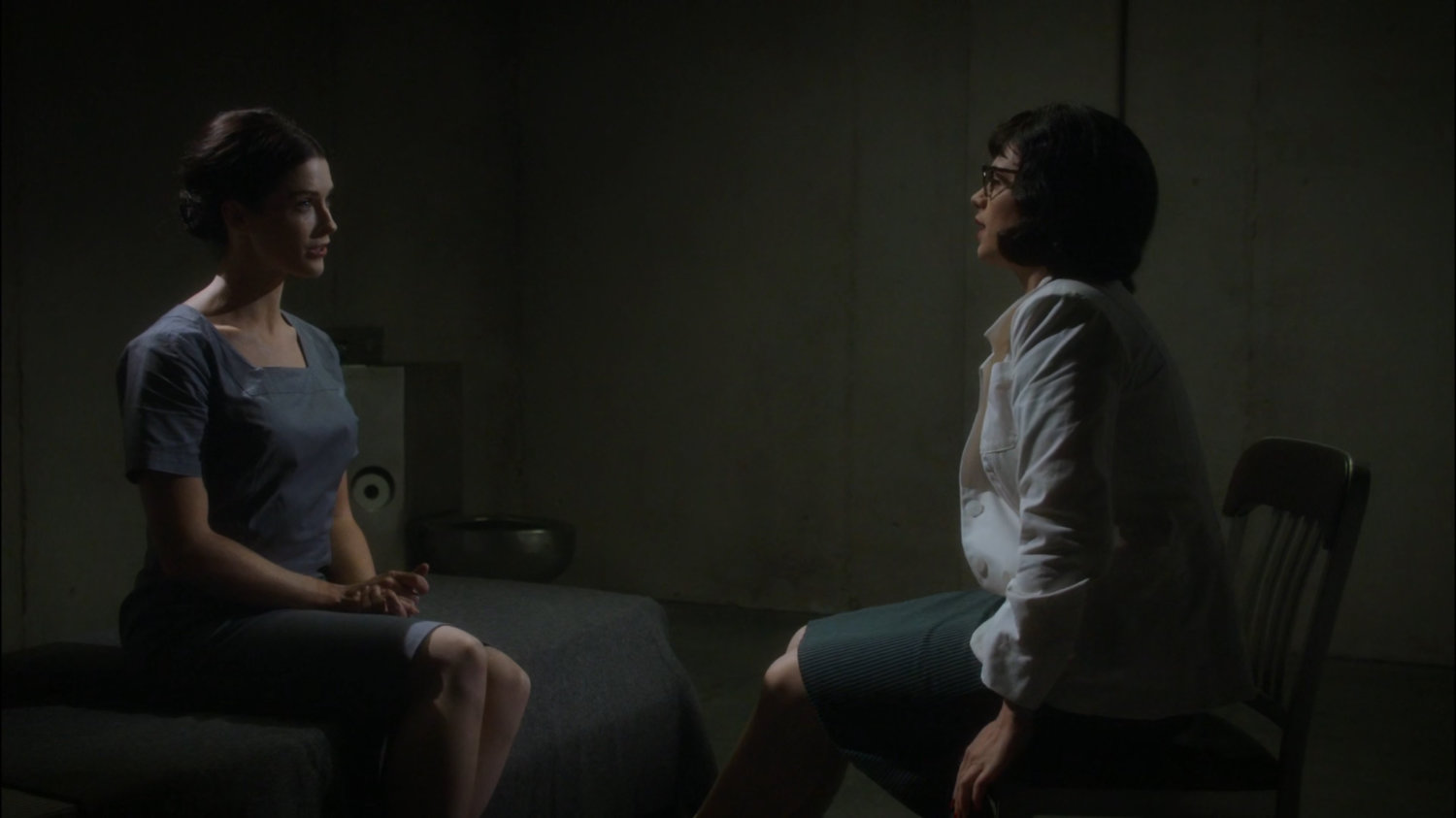 Peggy talks to Dottie in a jail cell.