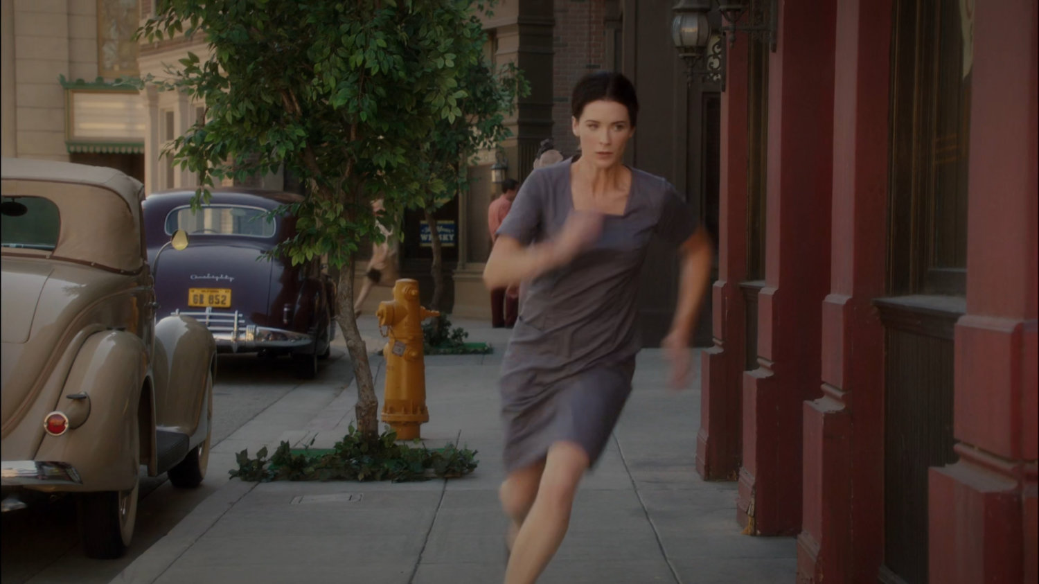 Dottie escapes the prison, running off on a sidewalk.