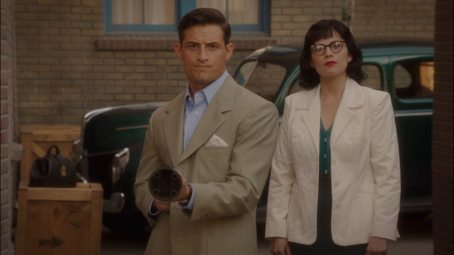 Sousa and Peggy in an alley with a net gun.
