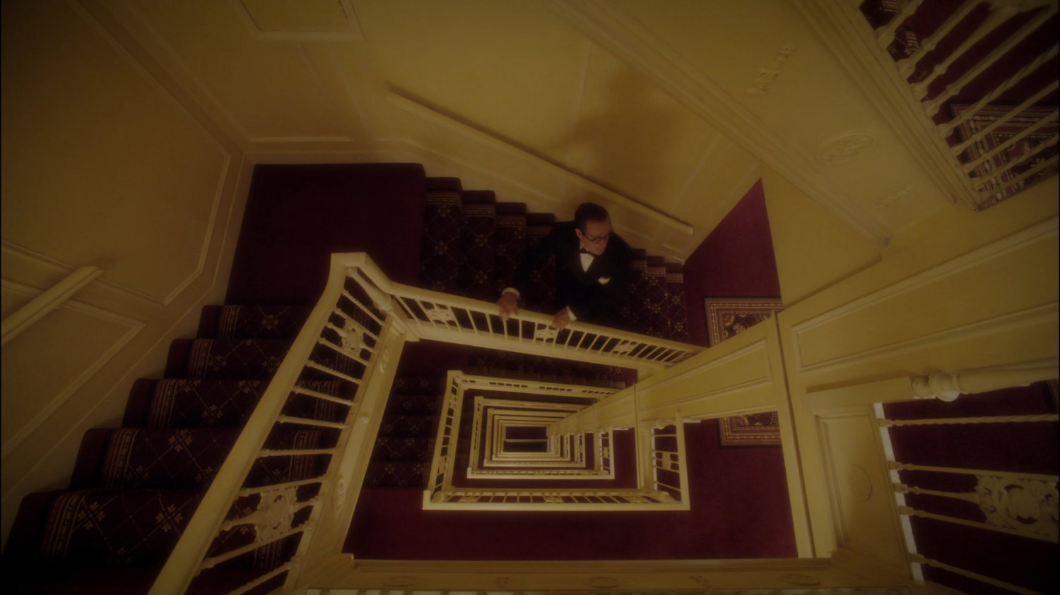 Jarvis running up a stairway in the MacArthur Grand Hotel.