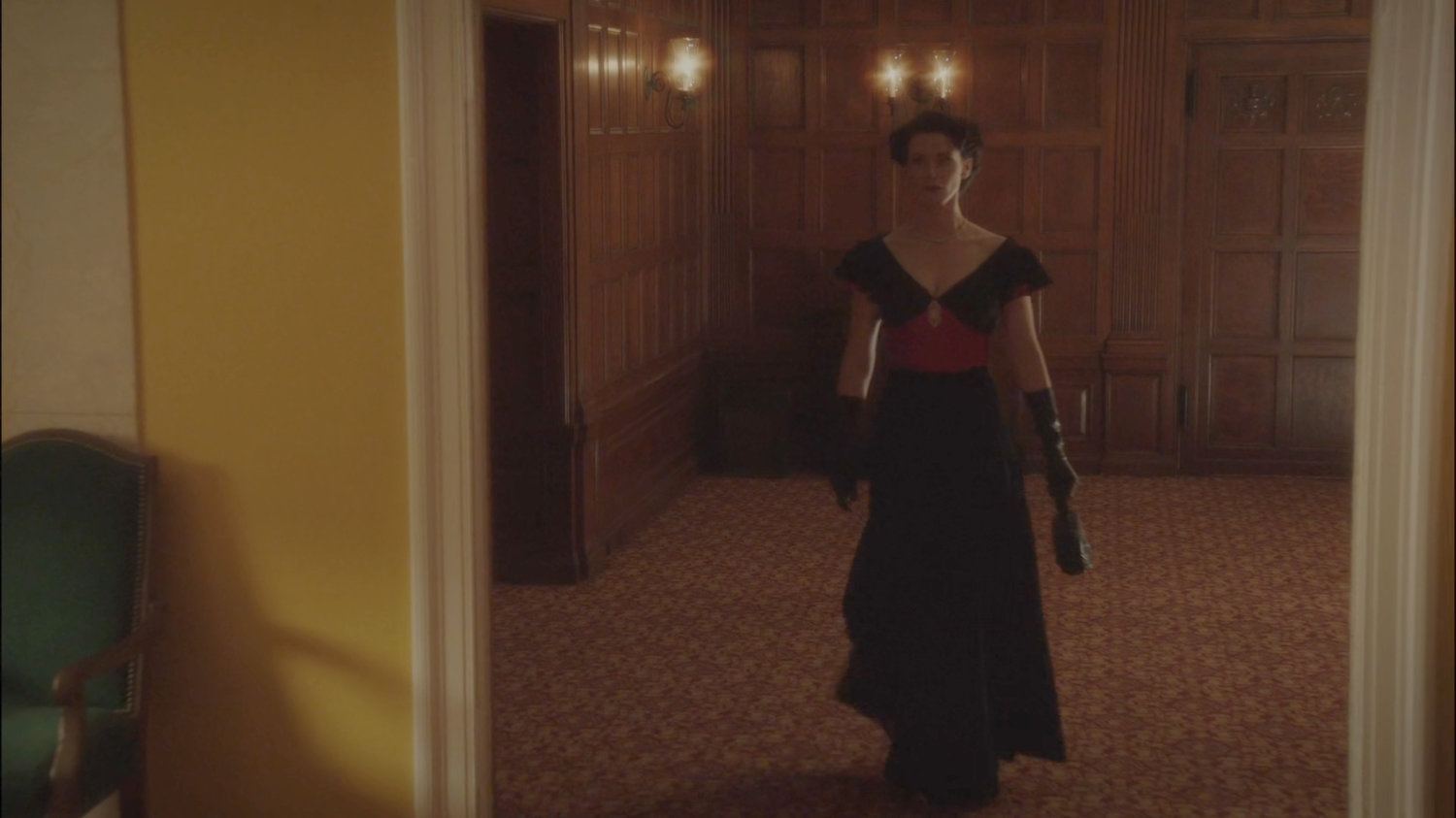 Dottie leaving a meeting room in the MacArthur Grand Hotel.