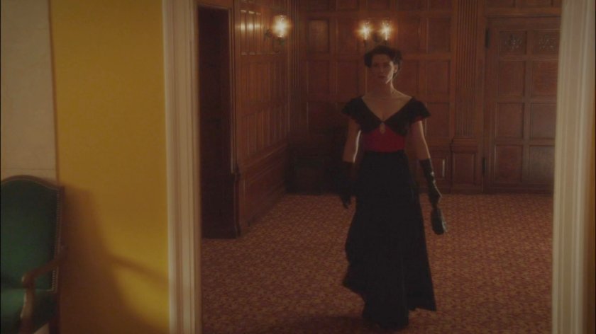 Dottie leaving a meeting room in the MacArthur Grand Hotel.