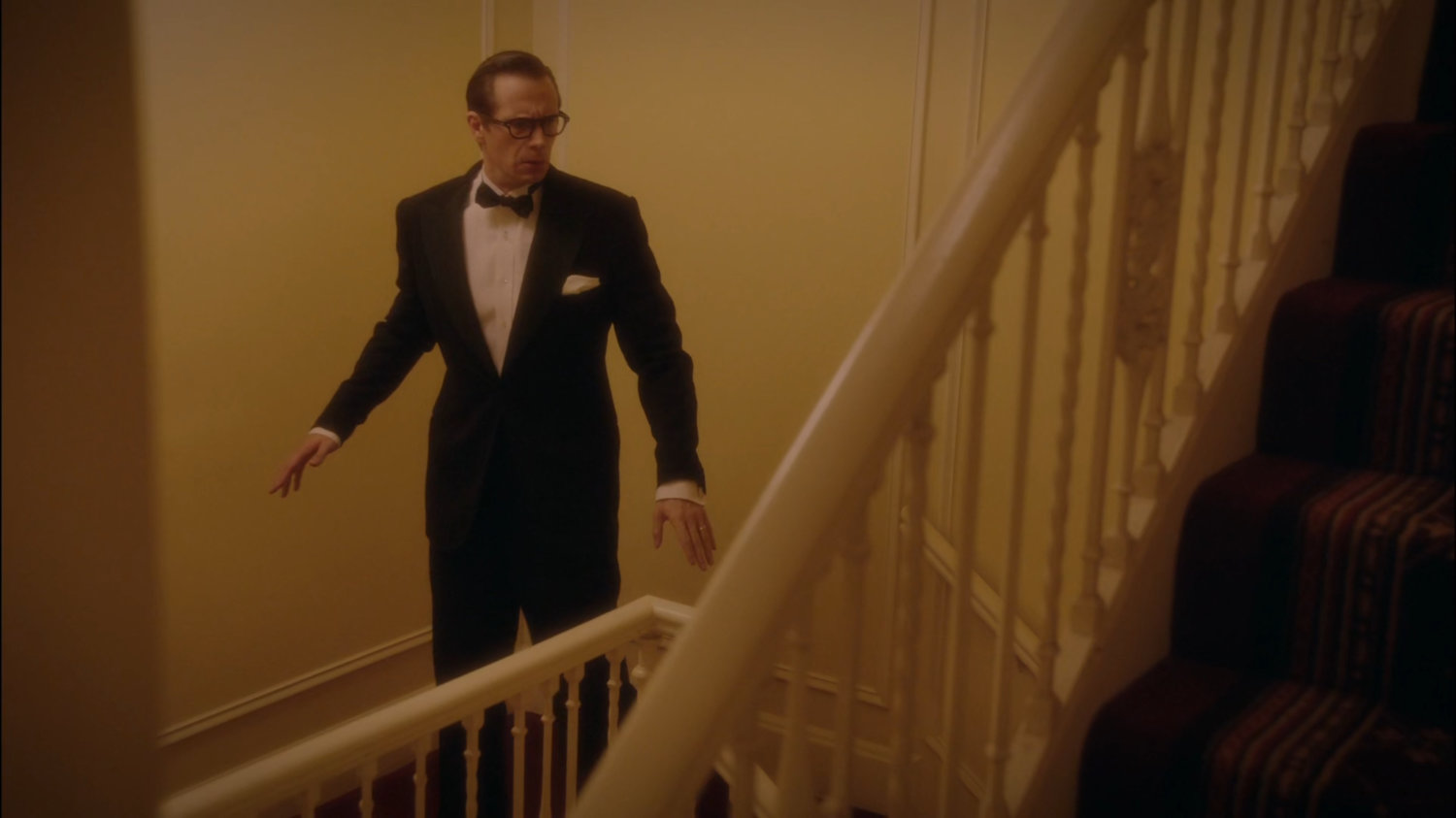 Jarvis pausing on a stairway in the MacArthur Grand Hotel.