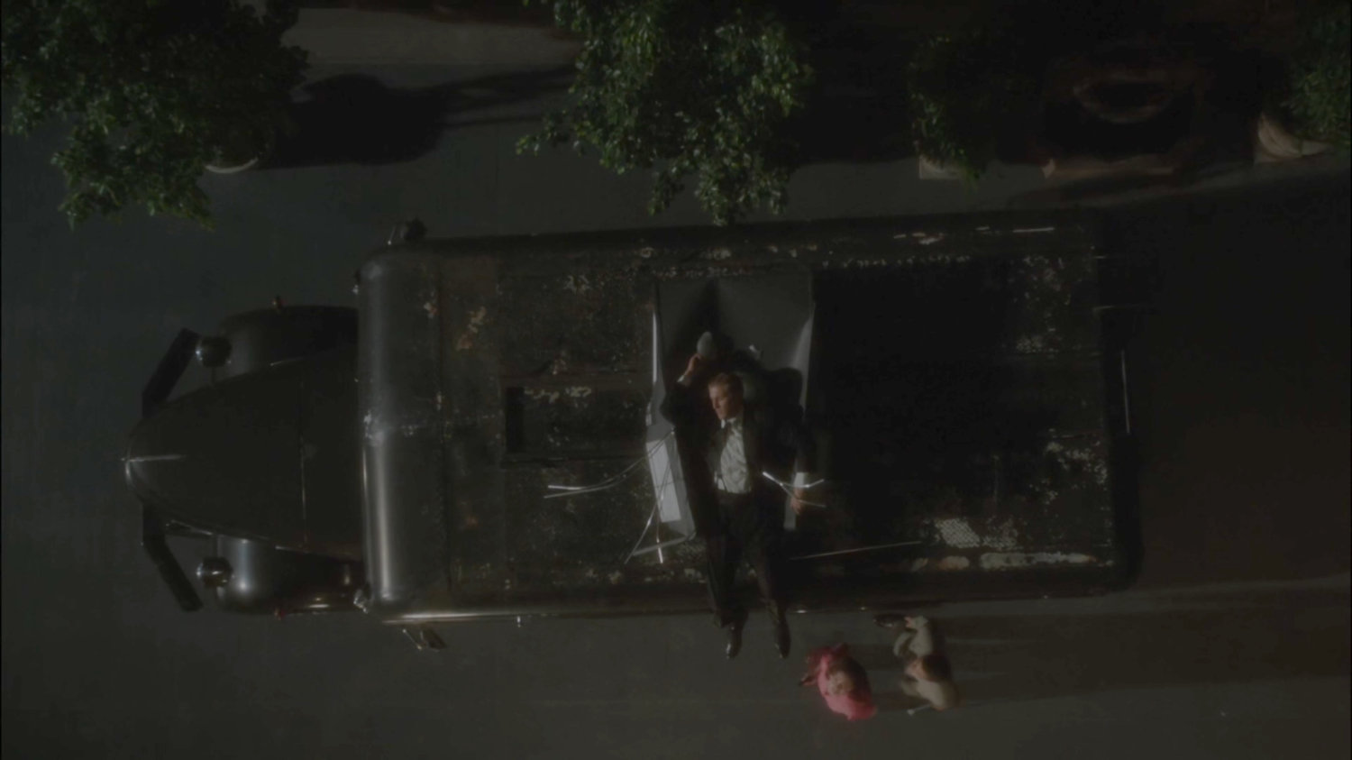 A guard laying on top of SSR truck after being thrown from MacArthur Grand Hotel window.