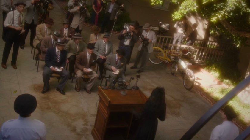 Audience gathered by podium at front gate of Anvil Studios.