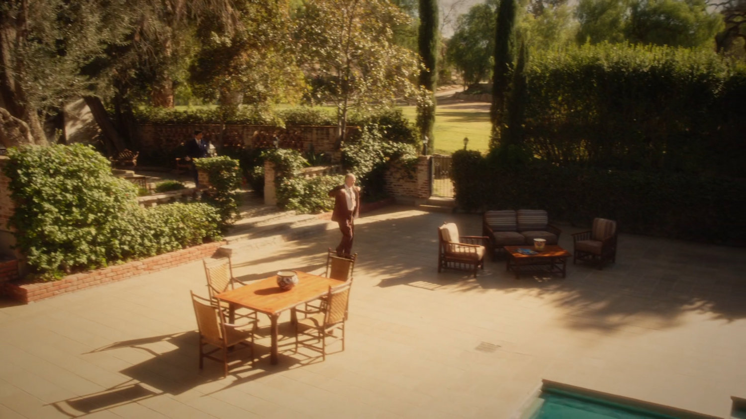 Vernon walking across courtyard of Chadwick Ranch.