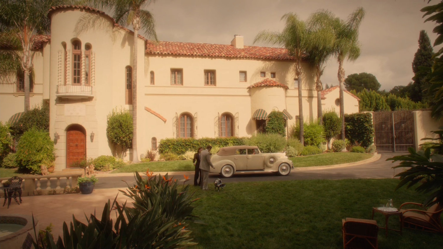 Jarvis and Peggy outside Stark Mansion.